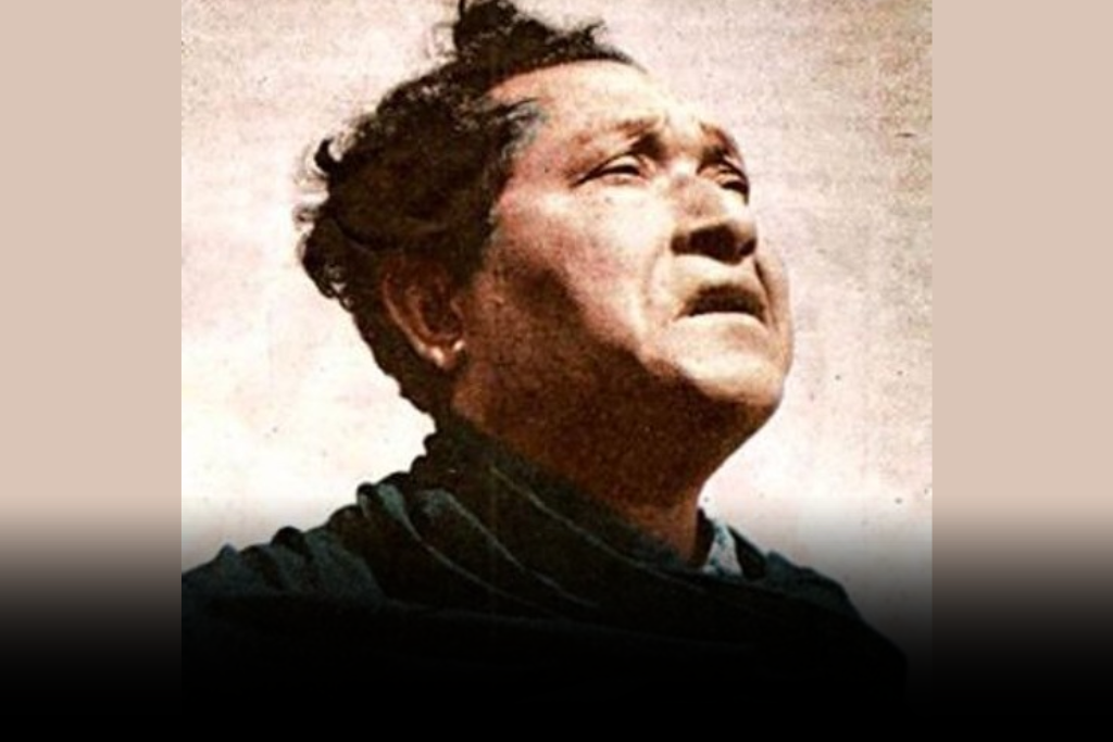 A vintage portrait of Kalaguru Bishnu Prashad Rabha, an Assamese cultural icon, looking upwards with an intense expression.