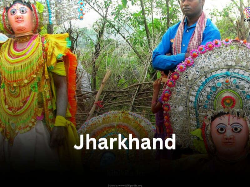 Traditional tribal performers in vibrant attire during a folk festival in Jharkhand.