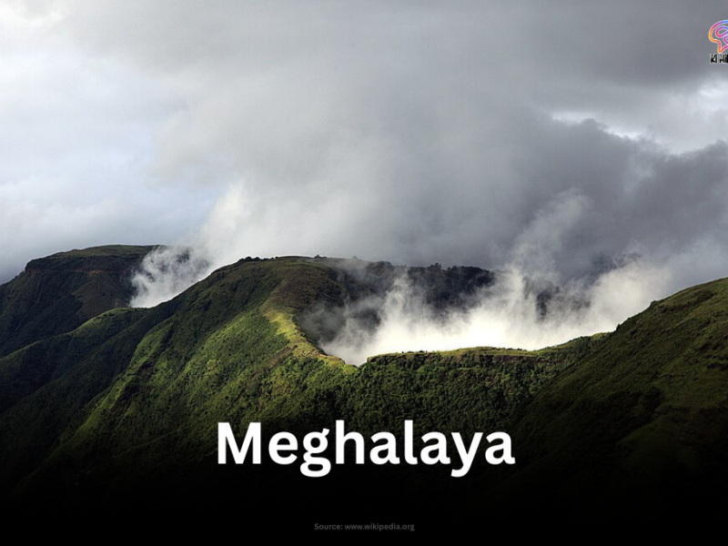 Mist and clouds rolling over lush green hills in Meghalaya.