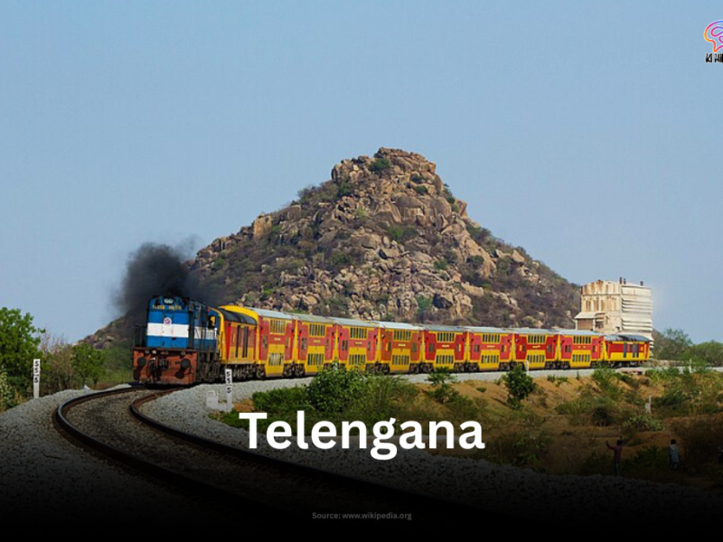 Kacheguda AC Double Decker Express train passing through rocky landscape in Telangana
