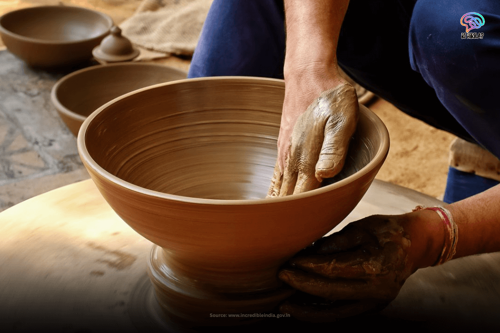 A close-up shot of a potter's hands skillfully shaping a wet clay bowl on a spinning potter's wheel in Haridwar.
