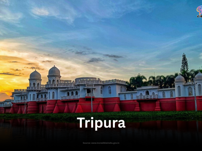 The magnificent Neermahal palace, with its white domes and red base, reflecting on the tranquil Rudrasagar Lake in Tripura at sunset.