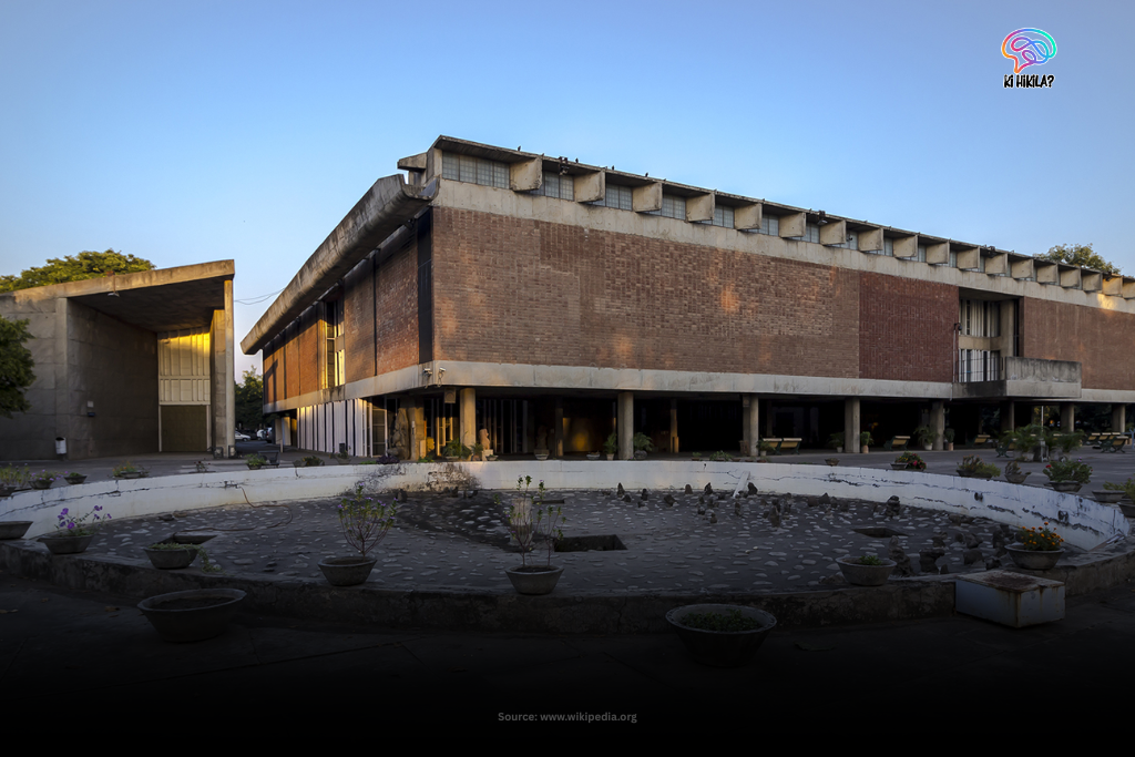 Chandigarh: The Inspiring Blueprint of India’s Urban, Cultural & Educational Excellence 3 The facade of the Government Museum and Art Gallery in Chandigarh, a modernist brick building with a large mural, seen from across a green lawn.