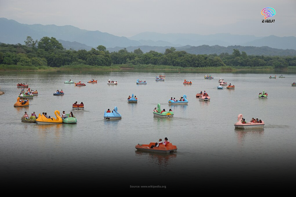 Chandigarh: The Inspiring Blueprint of India’s Urban, Cultural & Educational Excellence 2 A serene view of Sukhna Lake in Chandigarh at what appears to be dusk or dawn, with the calm water reflecting the sky and distant hills.