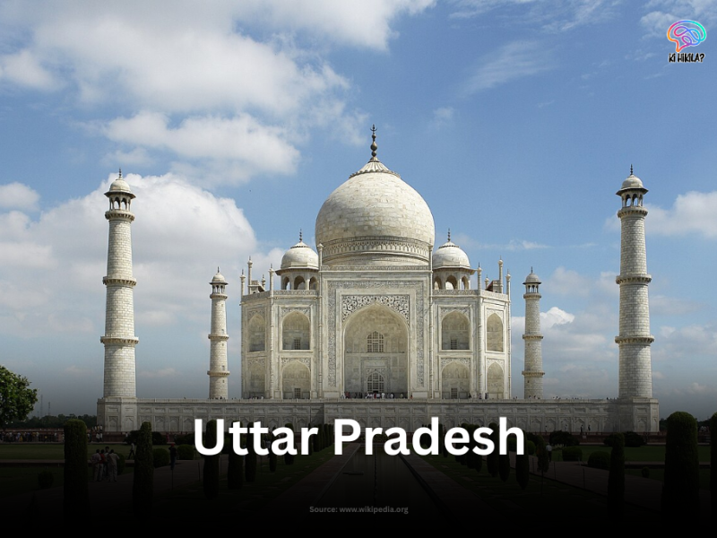 The Taj Mahal in Agra, Uttar Pradesh, with a clear blue sky and symmetrical Mughal gardens in the foreground.