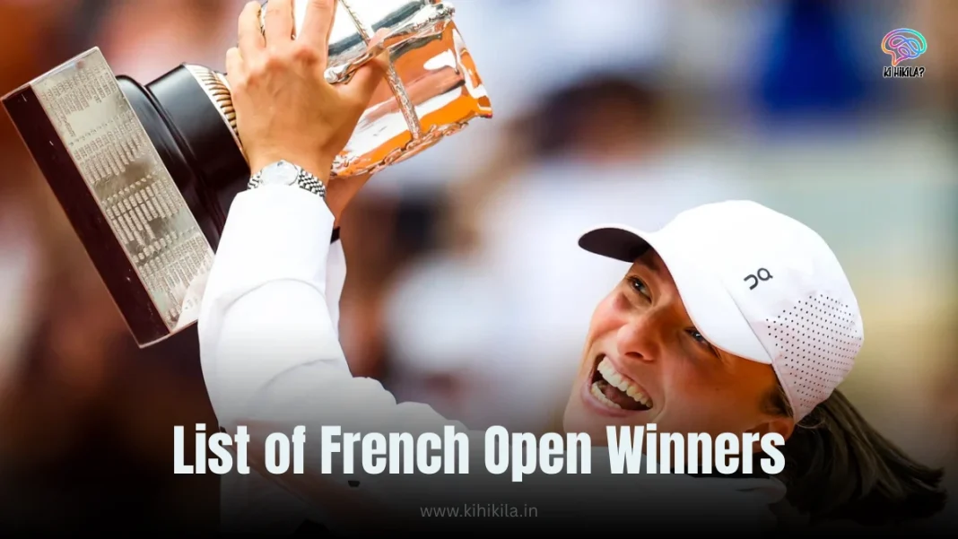 List of French Open Winners: A joyful tennis player in a white outfit and cap lifting the French Open trophy with both hands, smiling brightly against a blurred crowd background.