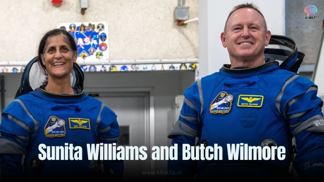 Sunita Williams and Butch Wilmore in white spacesuits smiling and holding orange roses, standing together before their space mission launch.